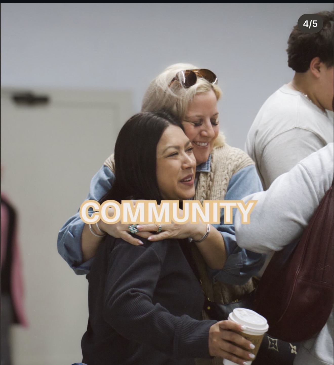 Two women embracing after service